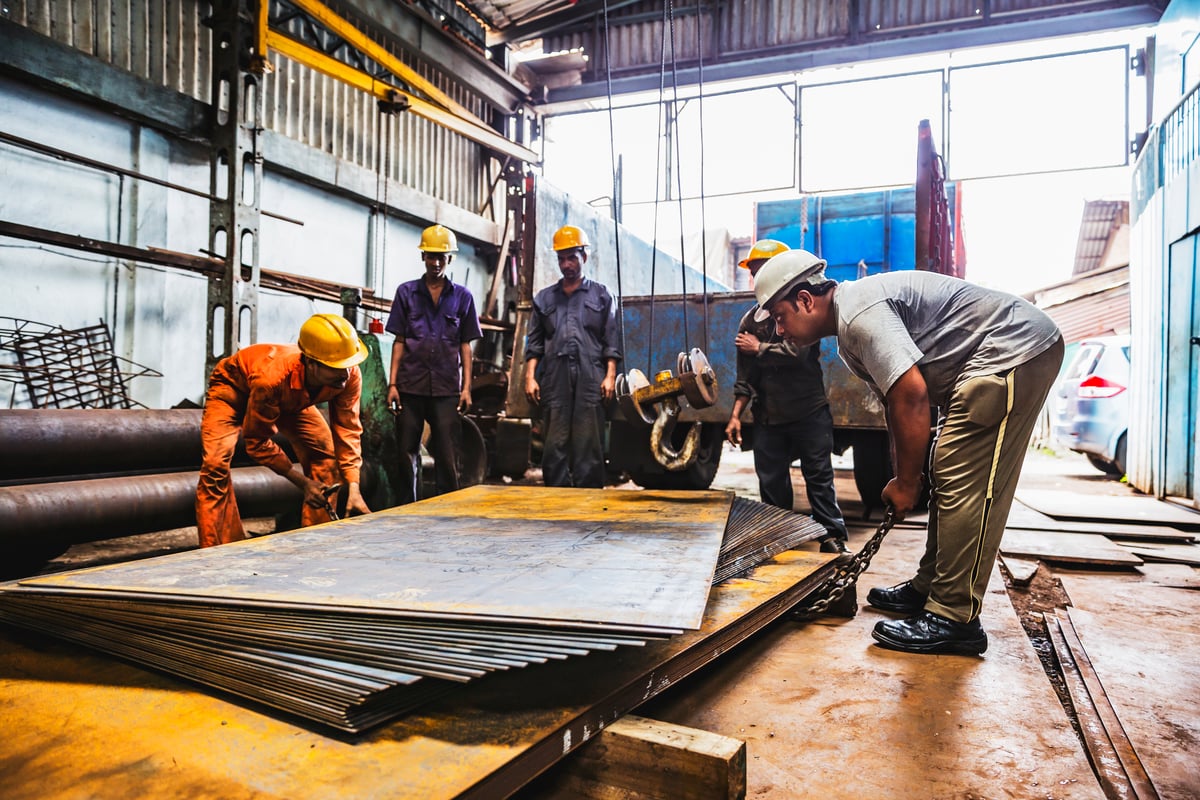 A crew working together in a steel fabrication shop